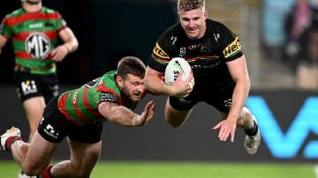 Luke Garner scores for Penrith as the defending premiers thumped beleaguered South Sydney. (Dan Himbrechts/AAP PHOTOS)