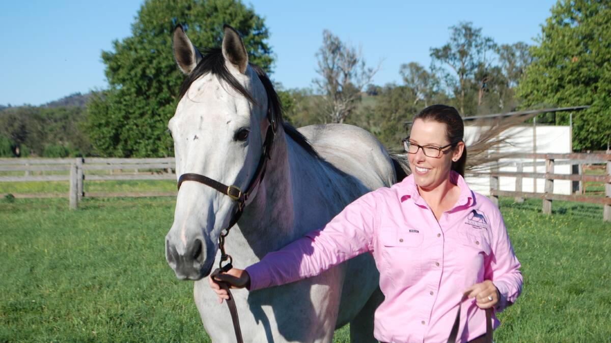 Kalil Equine director Caitlin Eather with Interventionist, trained by Mick Mulholland Racing in Dubbo. Picture by Rebecca Nadge