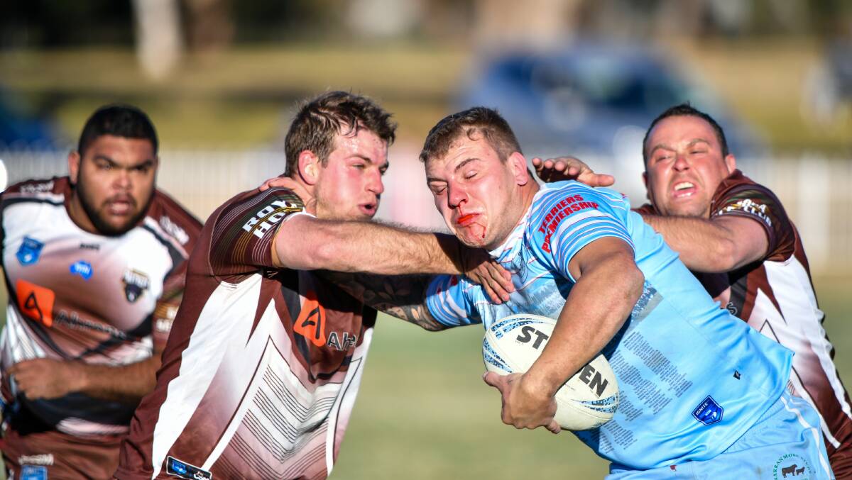 Gulgong's Jak Hart takes on several Gilgandra Panthers last weekend. Picture by Col Boyd. 