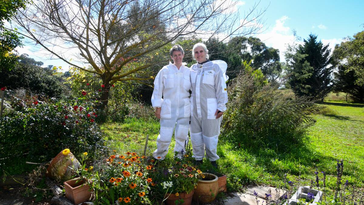 Julia Hutabarat and Shelby Ashelford wearing their beekeeping protective gear. Picture by Carla Freedman

