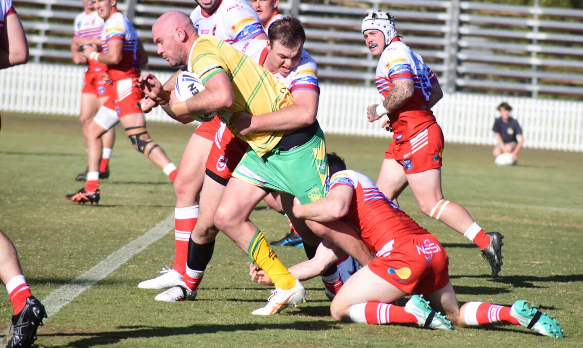 Jack Buchanan muscles through the Mudgee defence during Orange CYMS' round one win. Picture by Jude Keogh