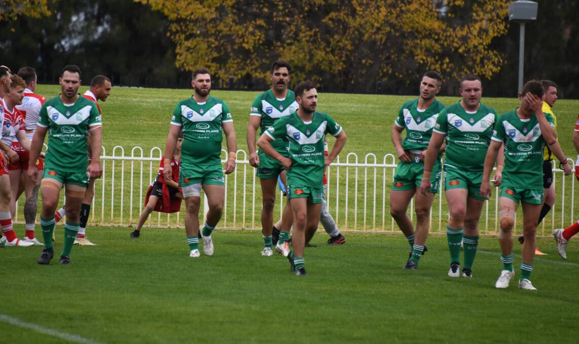 Dejected Dubbo CYMS players after one of Mudgee's 12 tries were scored on Sunday. Picture by Nick Guthrie