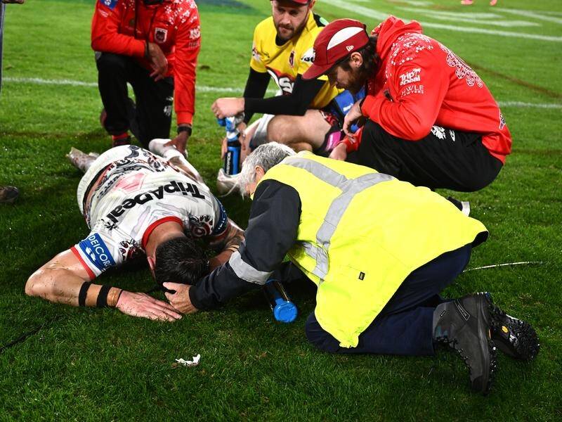 Jack Bird is left on the playing surface in agony after his ankle injury against the Dragons. (Dan Himbrechts/AAP PHOTOS)