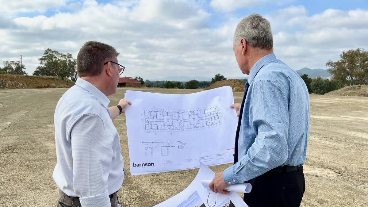 MP Dugald Saunders looks over printed plans for the facility with Council GM Brad Cam. Photo: Benjamin Palmer