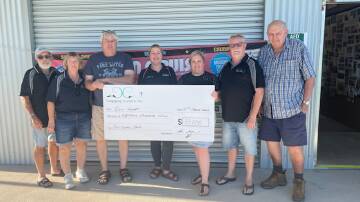 Presentation of the cheque to Can Assist following Cancruise 2024. Supplied