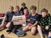 Walter, Rory, Jake, Braiden, Lachlan and Henry inside the St Matthews secondary campus gymnasium on the night of the sleepout. Picture supplied