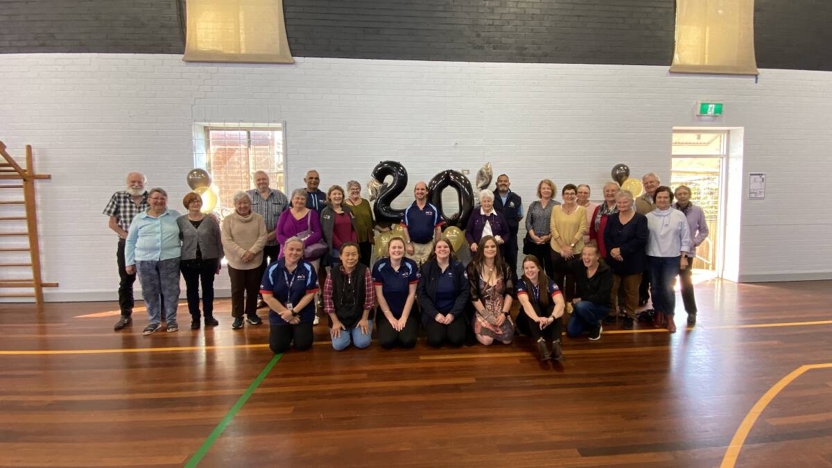 Phil poses with friends, family and colleagues on Friday at Mudgee PCYC. Supplied