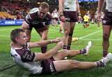 Manly fullback Tom Trbojevic in pain after straining a hamstring in the 30-24 loss to the Dolphins. (Dave Hunt/AAP PHOTOS)