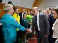 Prime Minister Anthony Albanese shakes the hand of Matildas player Michelle Heyman at the AIS. (Lukas Coch/AAP PHOTOS)