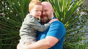 Charlie and dad Dan Berryman, who says he is unable to get an appointment with a paediatrician in the public health system. Picture: Les Smith