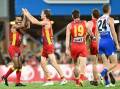 Gold Coast celebrate yet another goal during their 68-point thrashing of North Melbourne in Darwin. (Darren England/AAP PHOTOS)